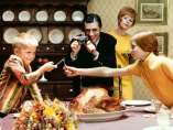 'Thanksgiving Dinner, children breaking wishbone'