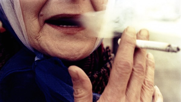 Woman with red lips smoking, 1975 Woman with red lips smoking, 1975