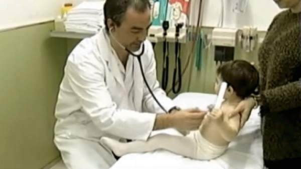 Niño con fiebre Niño con fiebre