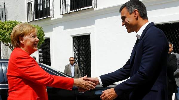 Merkel y Sánchez Merkel y Sánchez