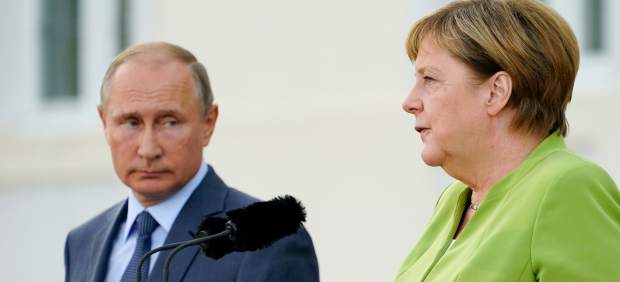 Vladimir Putin y Angela Merkel