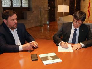El pte. Carles Puigdemont y el vpte. Oriol Junqueras