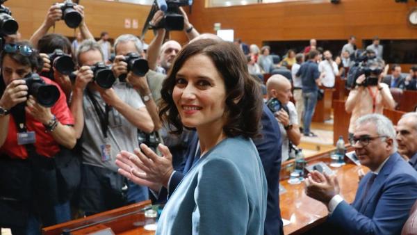 La candidata del PP a presidir la Comunidad de Madrid, Isabel Díaz Ayuso, momentos antes de intervenir en la primera sesión del Pleno de investidura de la Asamblea de Madrid. La candidata del PP a presidir la Comunidad de Madrid, Isabel Díaz Ayuso, momentos antes de intervenir en la primera sesión del Pleno de investidura de la Asamblea de Madrid.